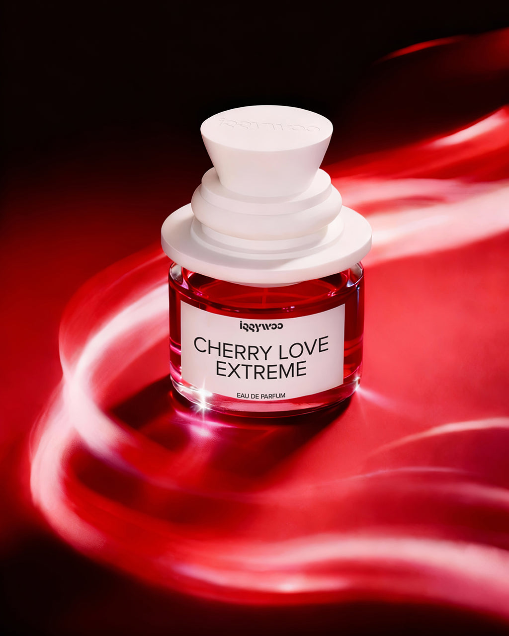 A small glass perfume bottle labeled 'lggywoo CHERRY LOVE EXTREME' with a white cap, filled with red liquid, set against a dark red and black background with glowing red light streaks.