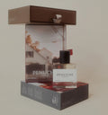 Penuche perfume bottle and packaging on a beige background