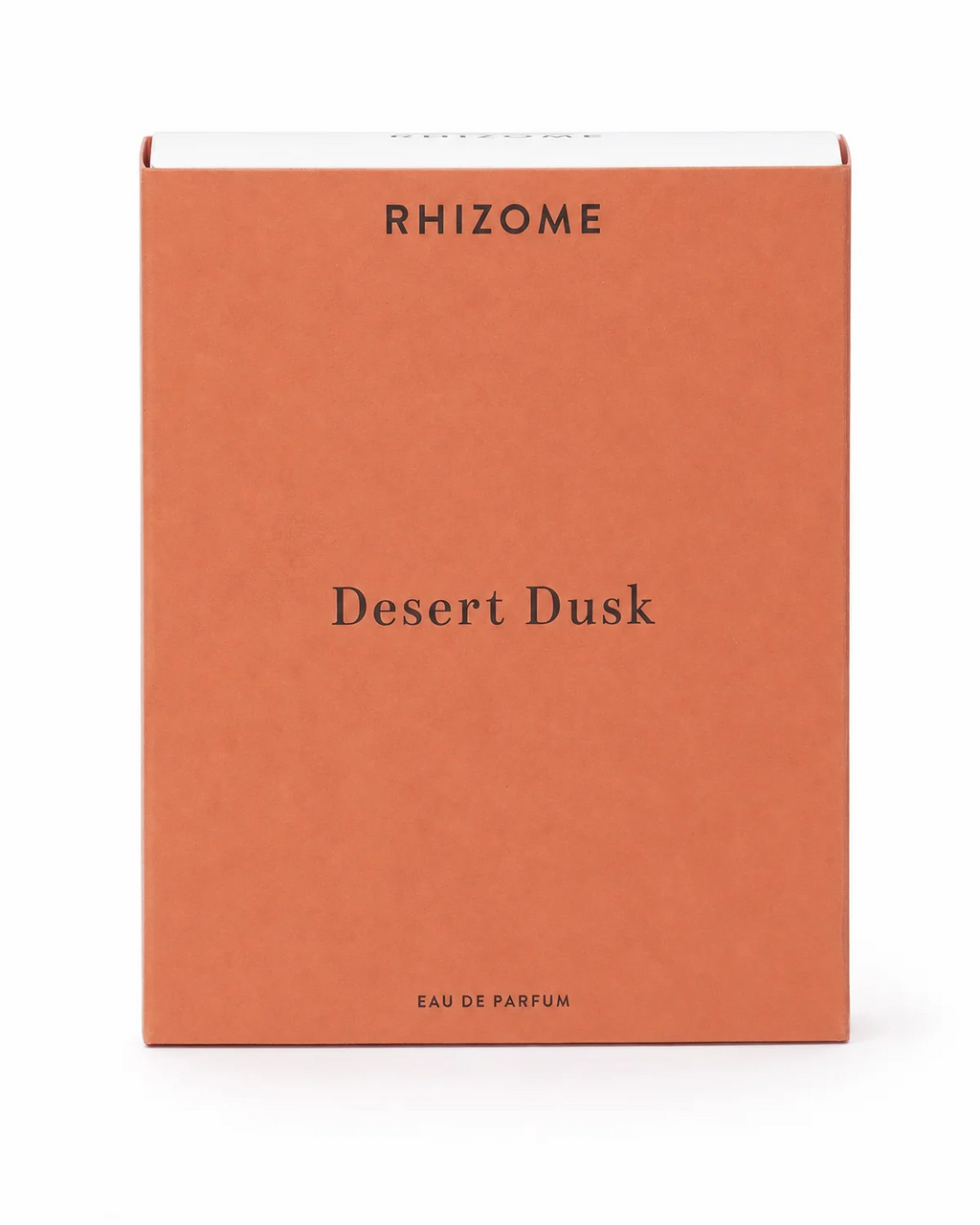 A rectangular orange cardboard box for Rhizome Desert Dusk Eau de Parfum, photographed against a clean white background.