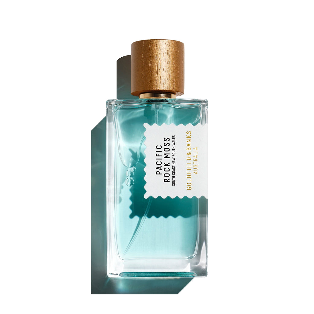 Pacific Rock Moss Perfume bottle by Goldfield and Banks with gold cap on a white background