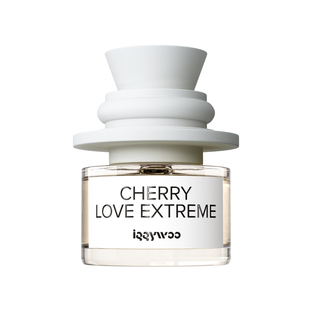 A clear glass bottle fragrance with pale amber liquid, a white label reading 'CHERRY LOVE EXTREME' and 'iggywoo', topped with a sculptural matte white cap on a white background.
